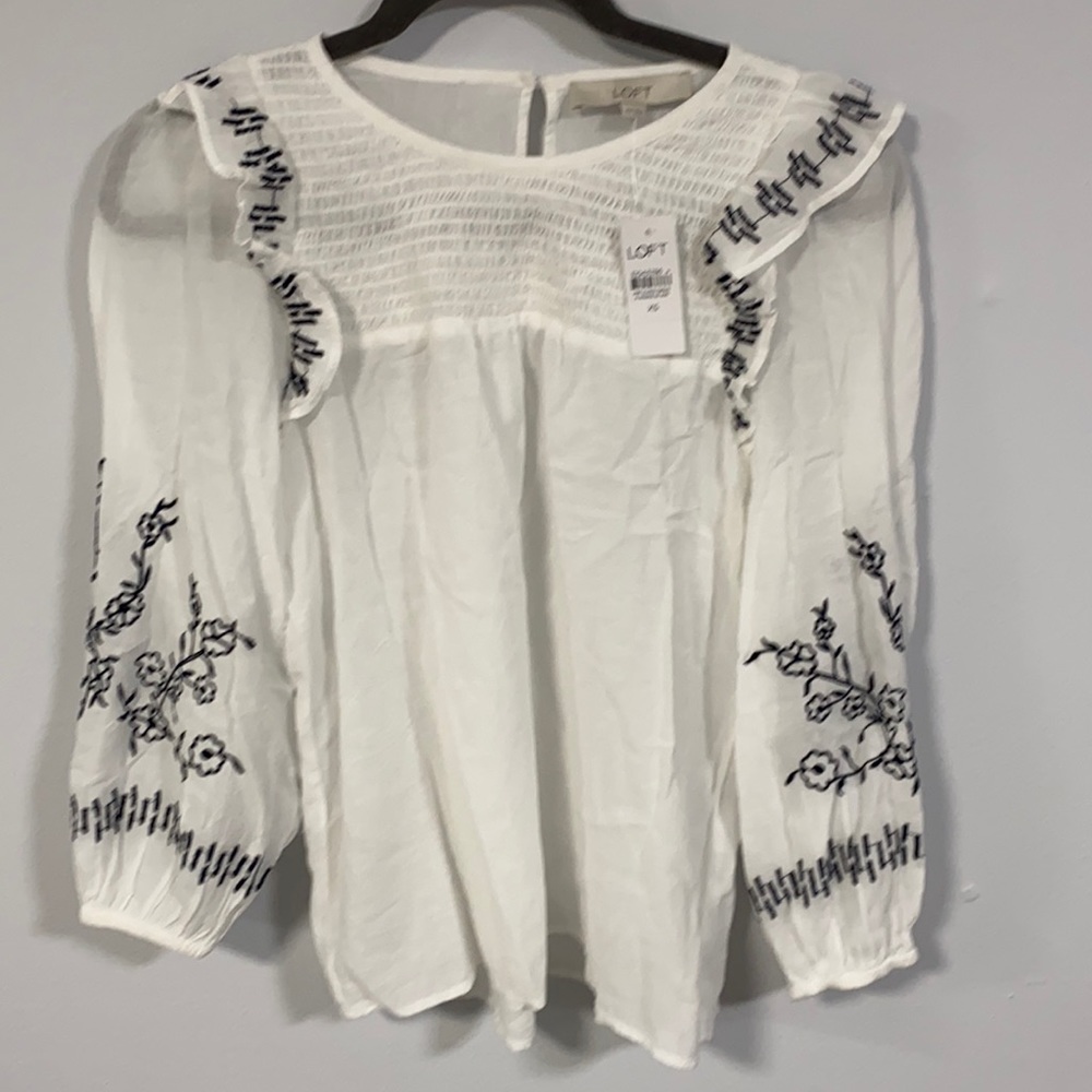 Women’s loft size small top. White  black flowers